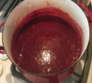 Plum juice in pot