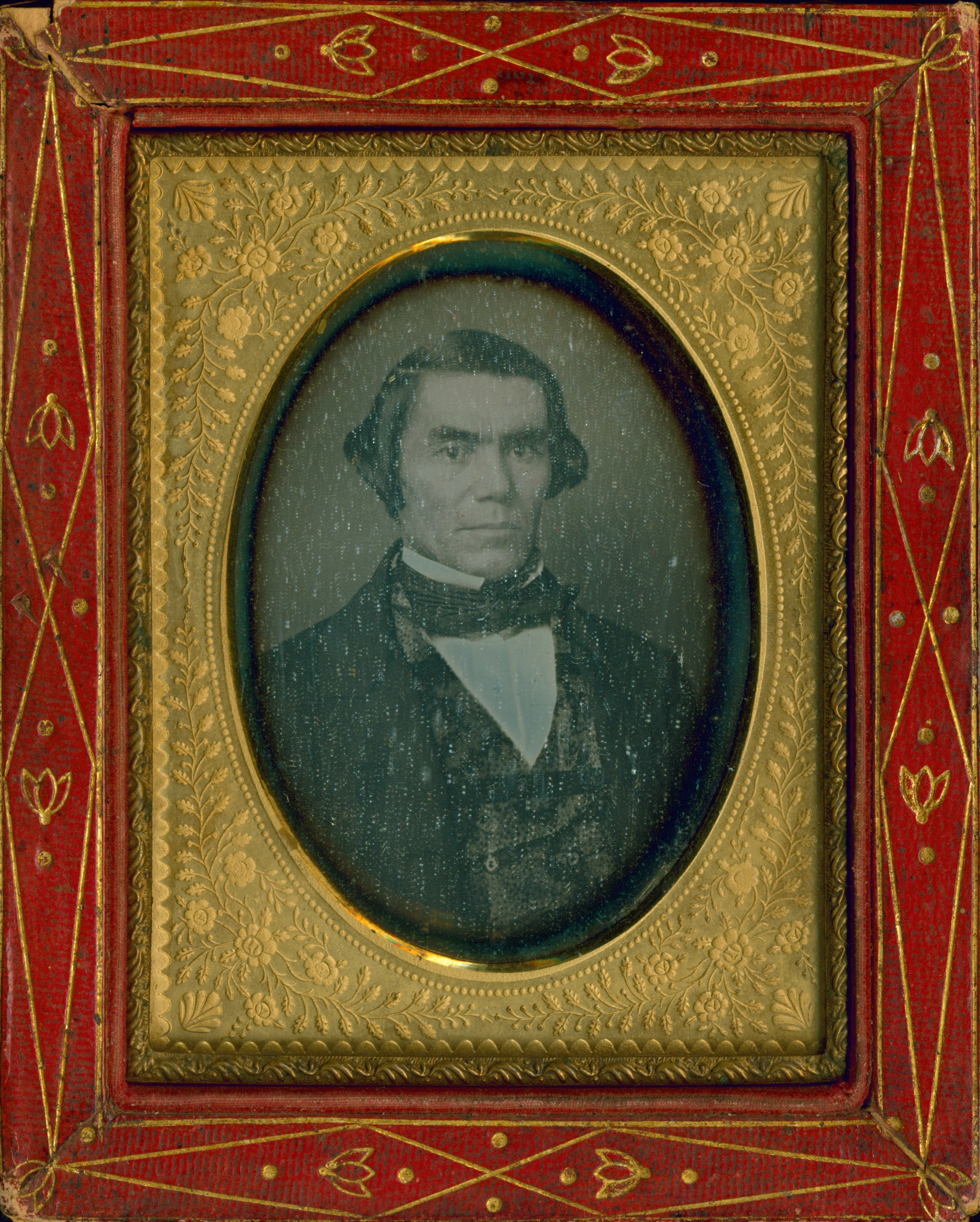 Historical black and white portrait of Silas Armstrong in ornate red frame