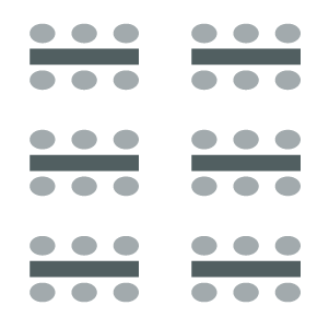 Room set up with chairs on both sides of tables