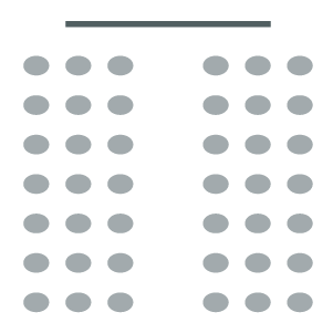 Room set up with screen at front and two columns of chairs with a central aisle