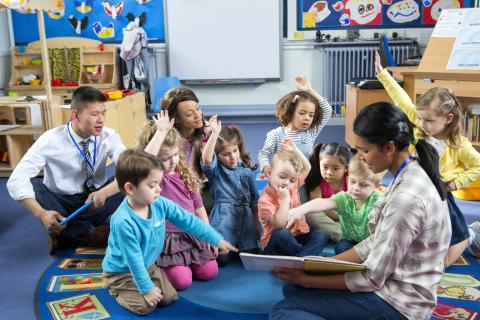 Woman reading to children