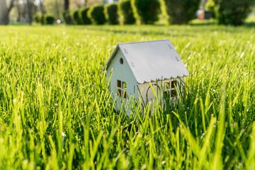 a little house on  green lawn