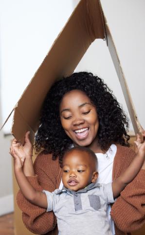 Family in cardboard fort