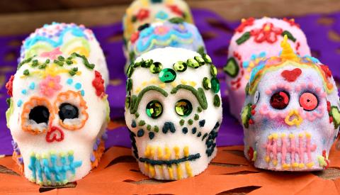 sugar skulls decorated with icing and sequins