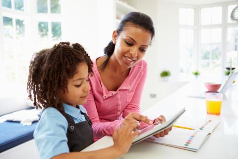 mother and child using tablet