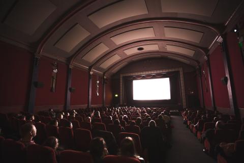 Movie theater with people sitting