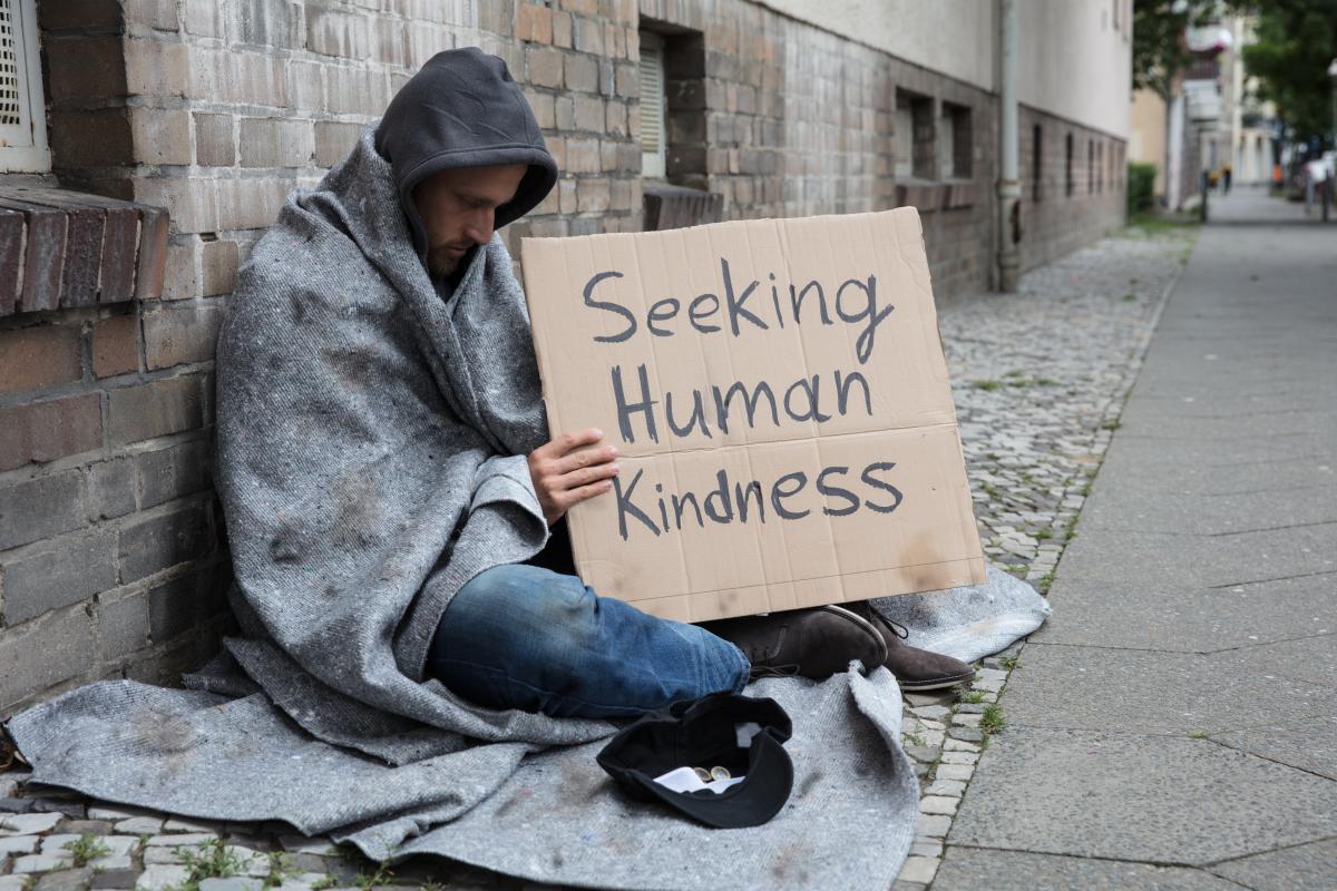 Homeless man with sign