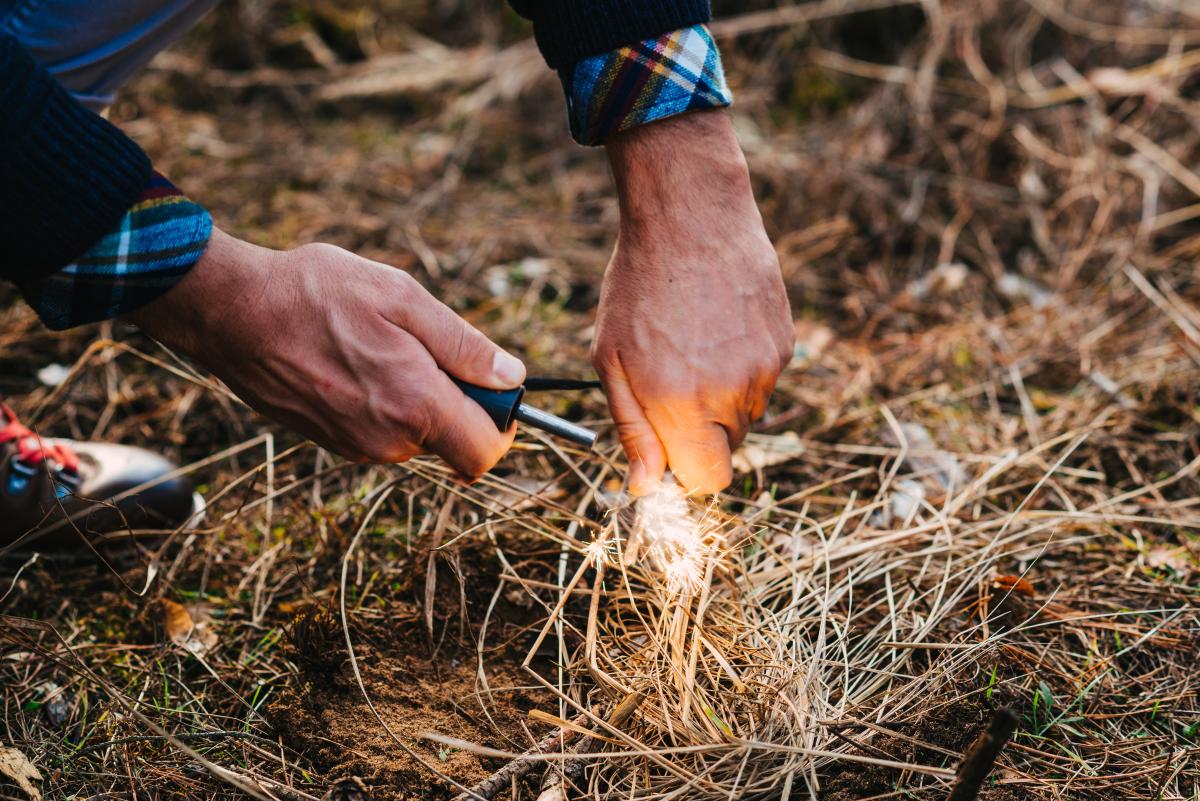 person starting a fire