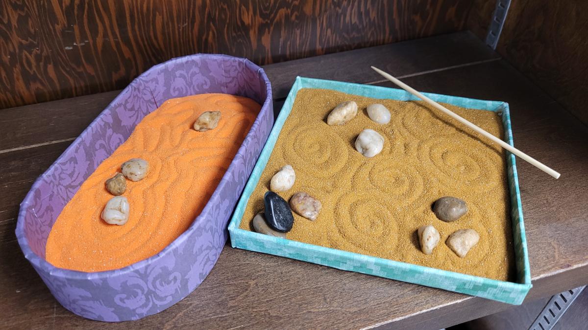 two mini zen gardens with pebbles