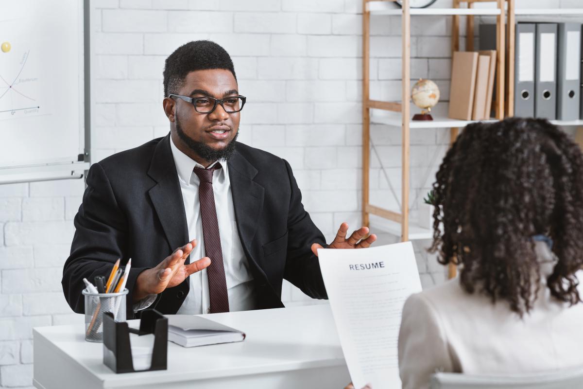 A man and a woman sitting across from each other at the table