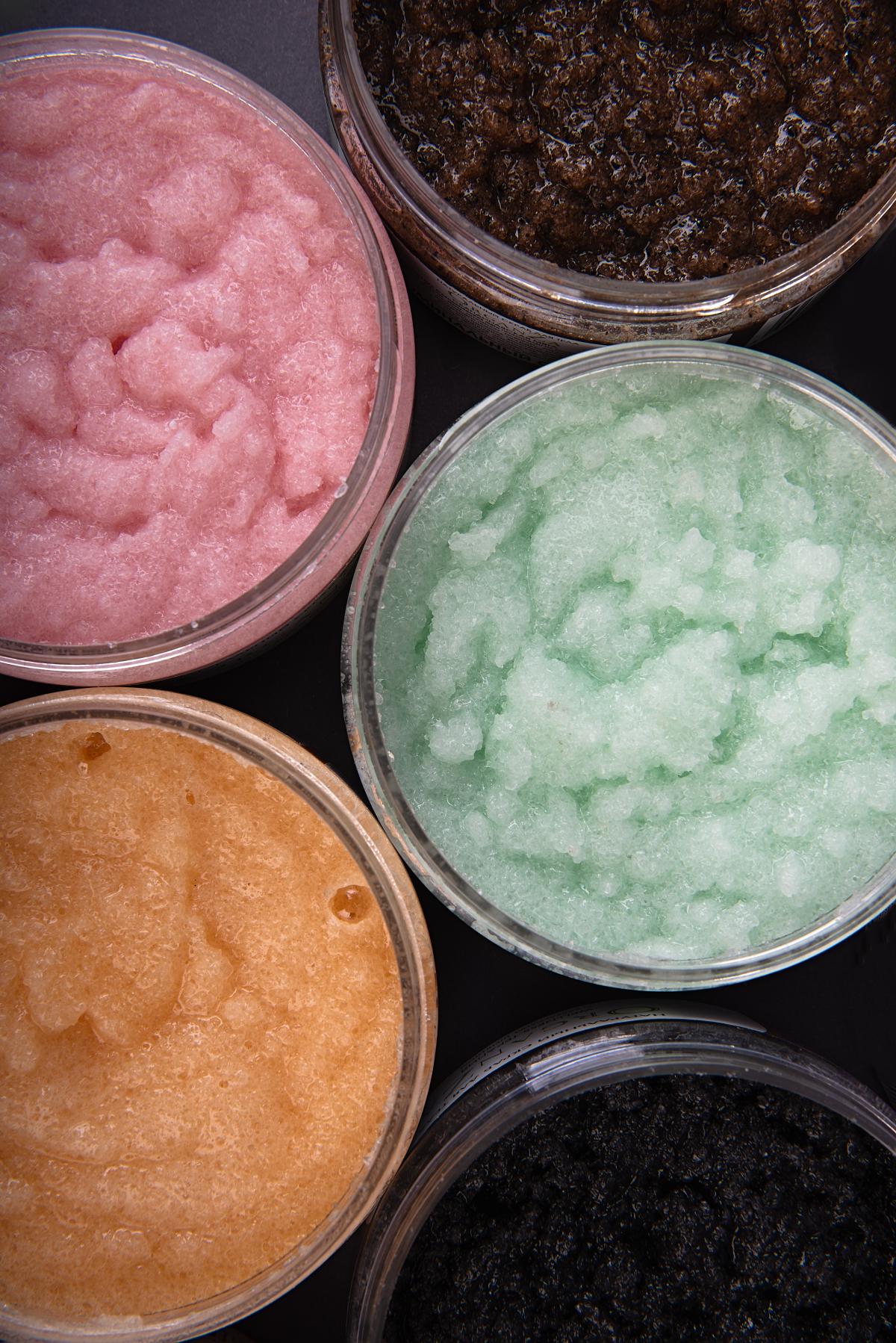 Jars of colored sugar scrubs