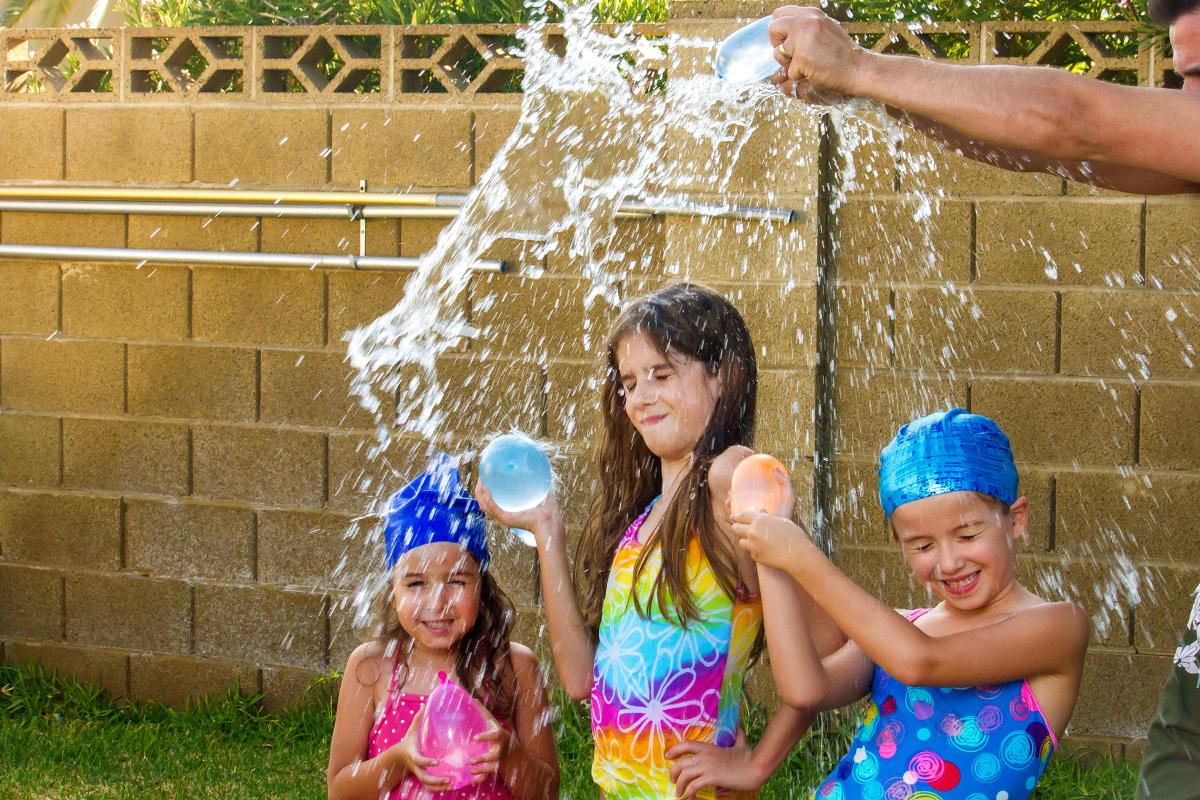 Kids playing with water balloons