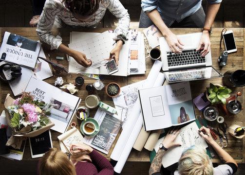 a group of writers, writing. 