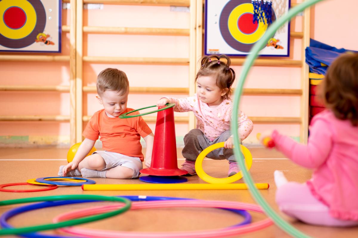 children playing with rings and safety cones