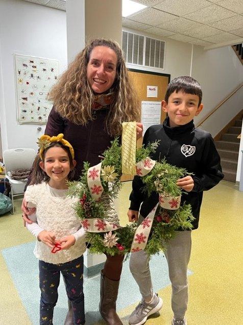 family with wreath