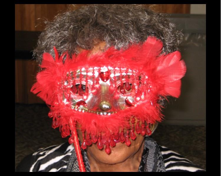 Woman in a red mask