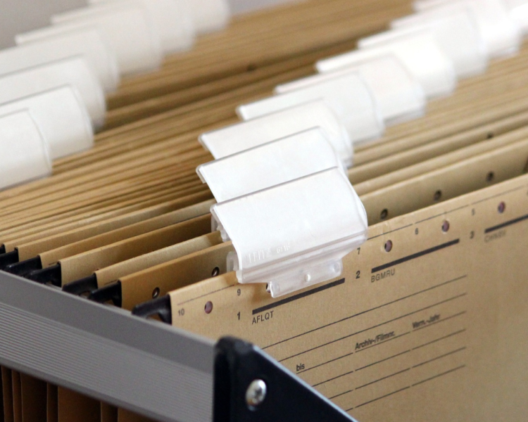 Stock photo of hanging folder files with labels