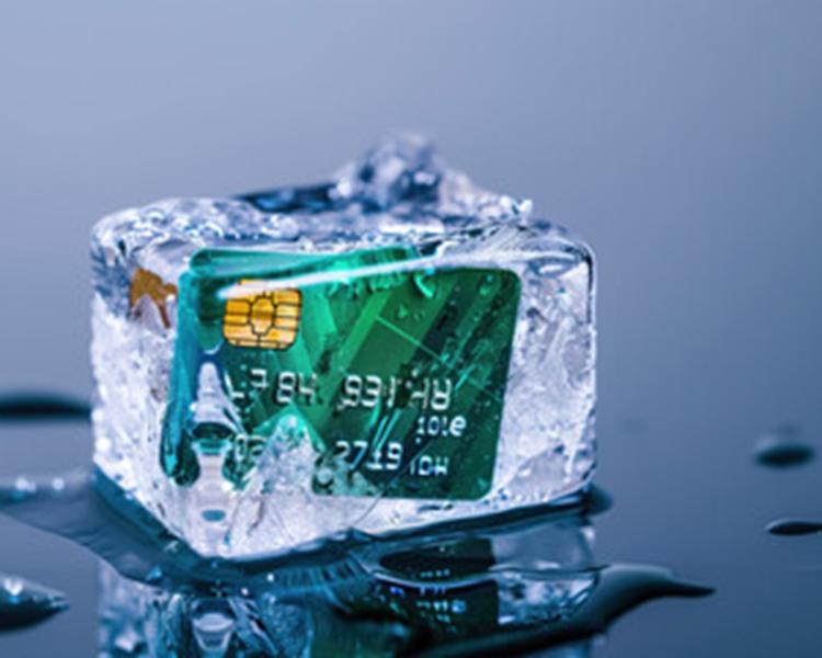 A credit card frozen in a block of ice